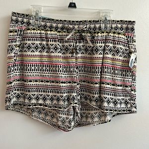 Old Navy white shorts with black yellow and pink pattern. New with tags
